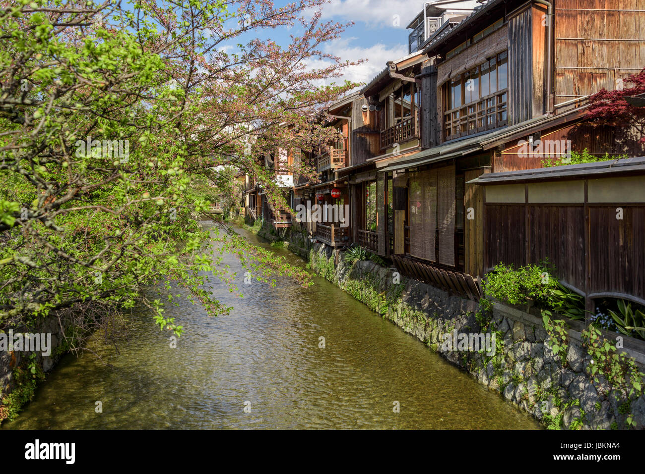 Shirakawa river runs behind many of the traditional old buildings, most are teahouses or restaurants. Stock Photo
