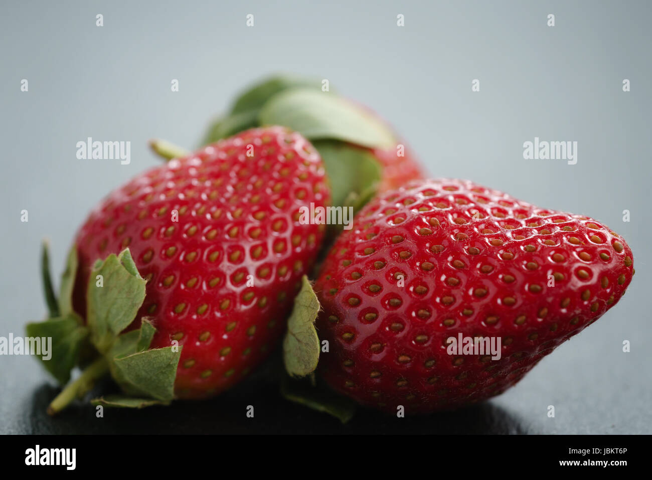 ripe organic strawberries on slate background Stock Photo - Alamy