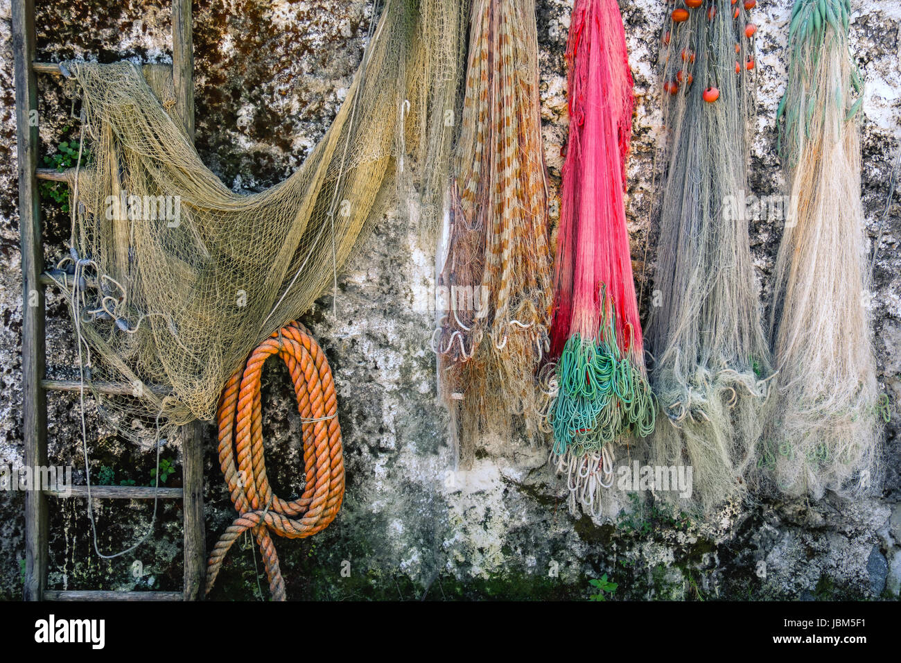 fishing nets hanging on wall background Stock Photo Alamy