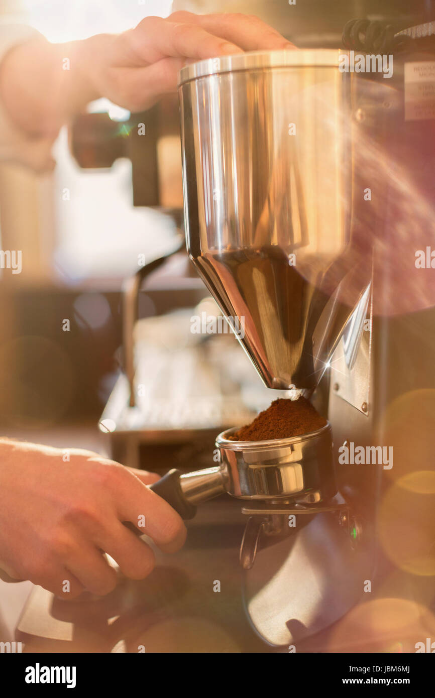Close up barista using espresso machine grinder Stock Photo Alamy
