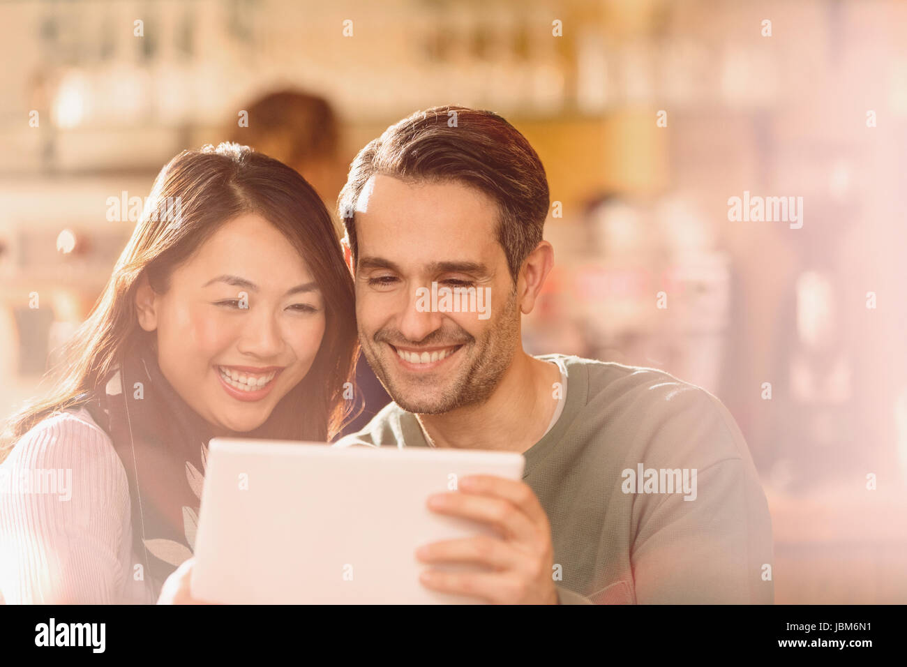 Couple video chatting with digital tablet Stock Photo