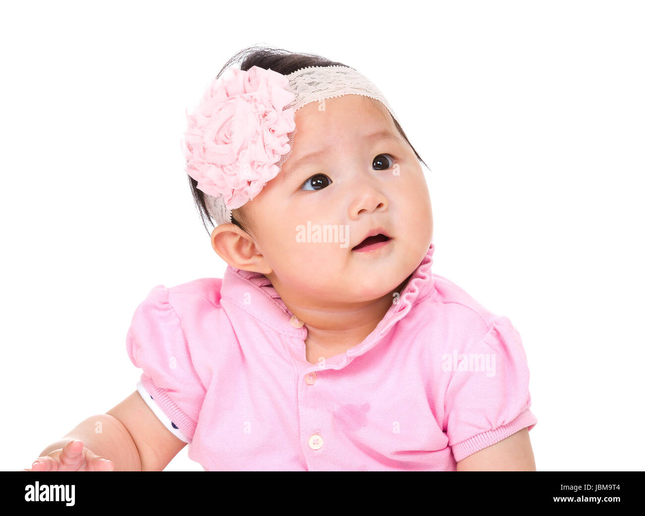 Baby girl looking up Stock Photo - Alamy