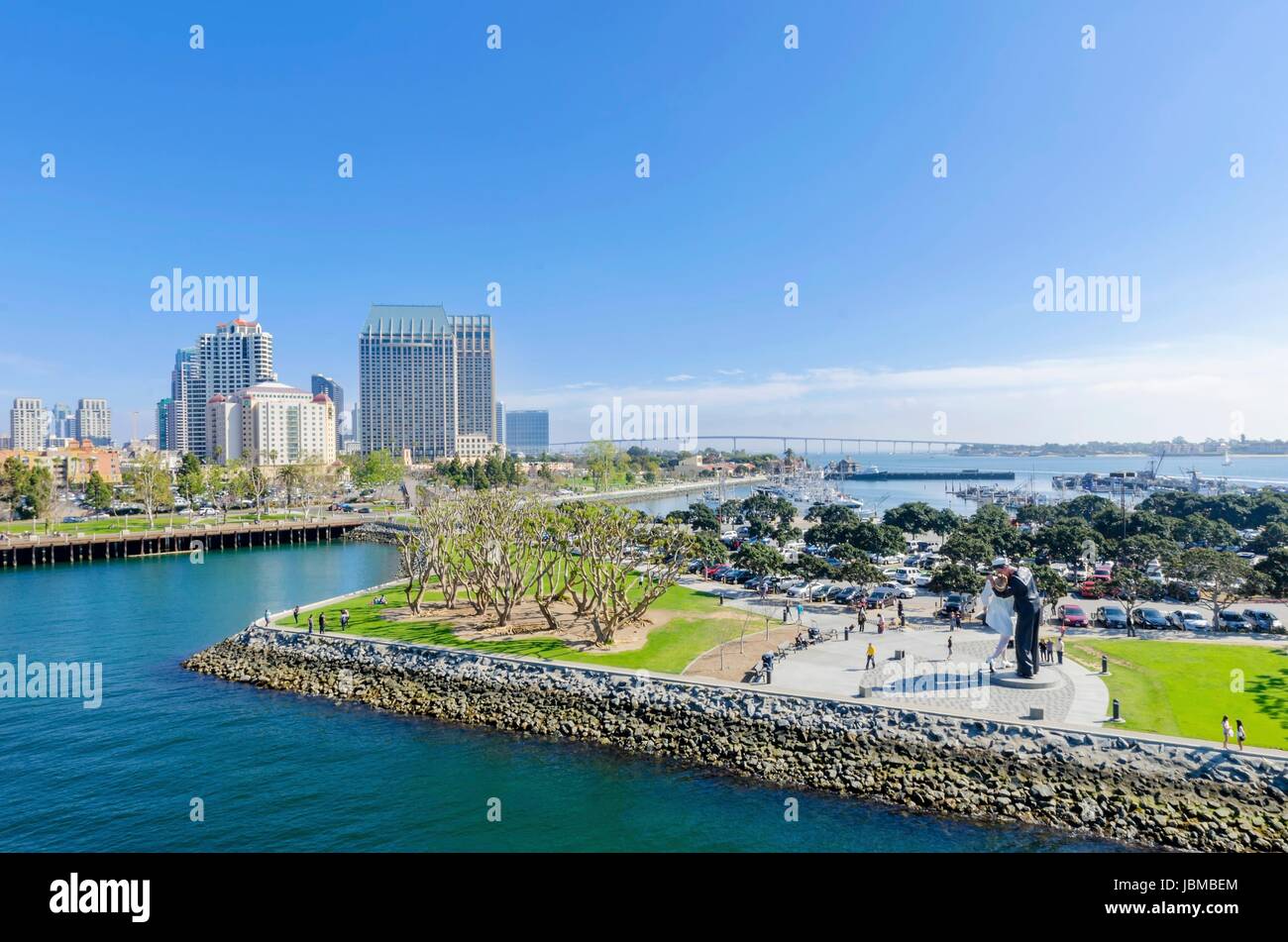 A view of the Unconditional surrender statue in Downtown San Diego marina in southern California in the United States of America. Some of the local architecture, commercial buildings and the coronado bridge in the city. Stock Photo