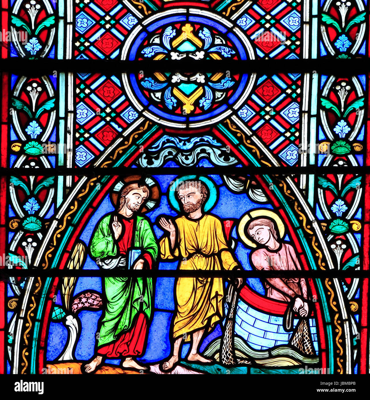 Life of Jesus window, Feltwell church, stained glass by Didron of Paris, 1859, Jesus with apostles Peter and Andrew, casting fishing net in Sea o Stock Photo