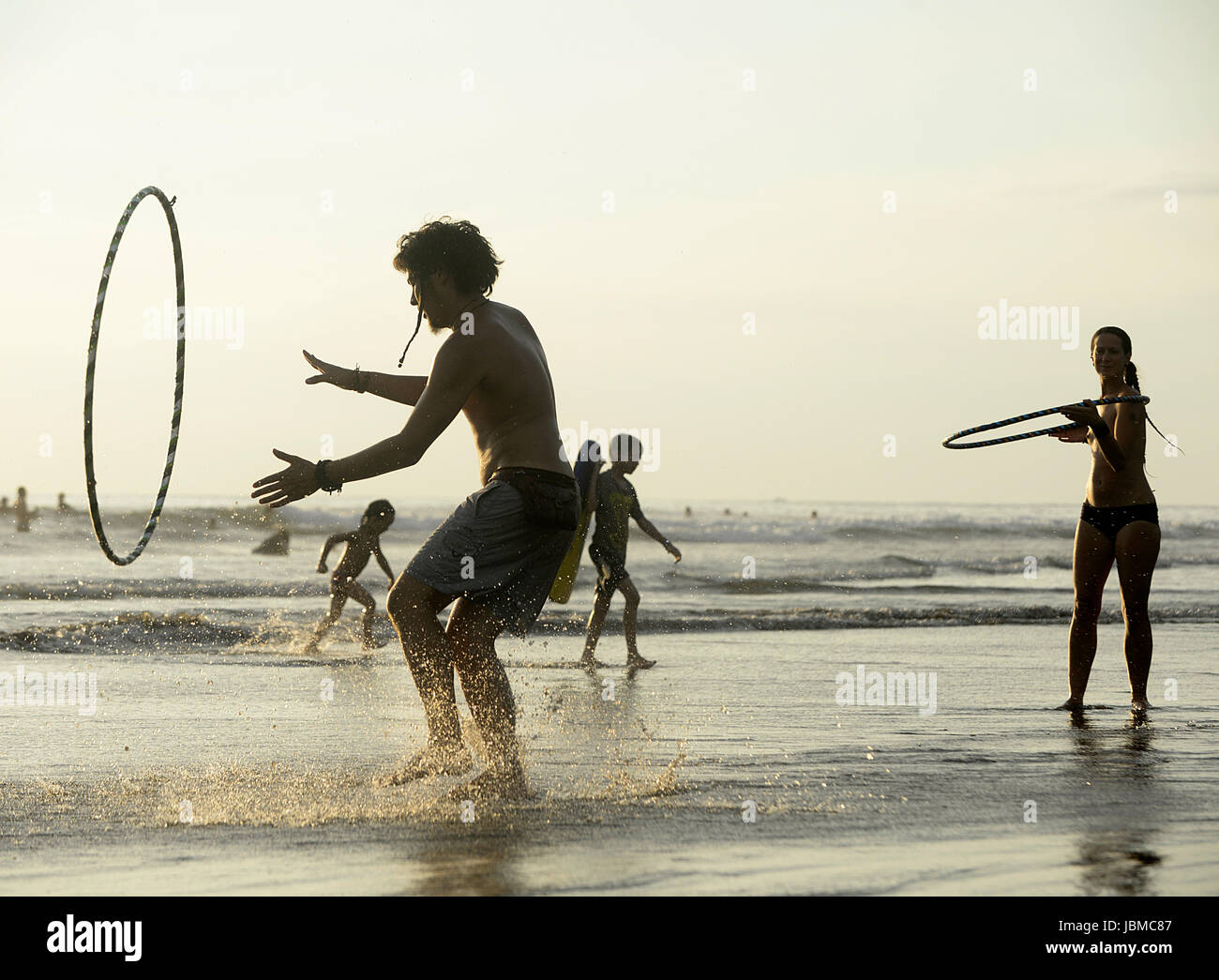 Hula's Rixa Hula hoopers dance on the beach at the 2015 Envision Festival, a ...