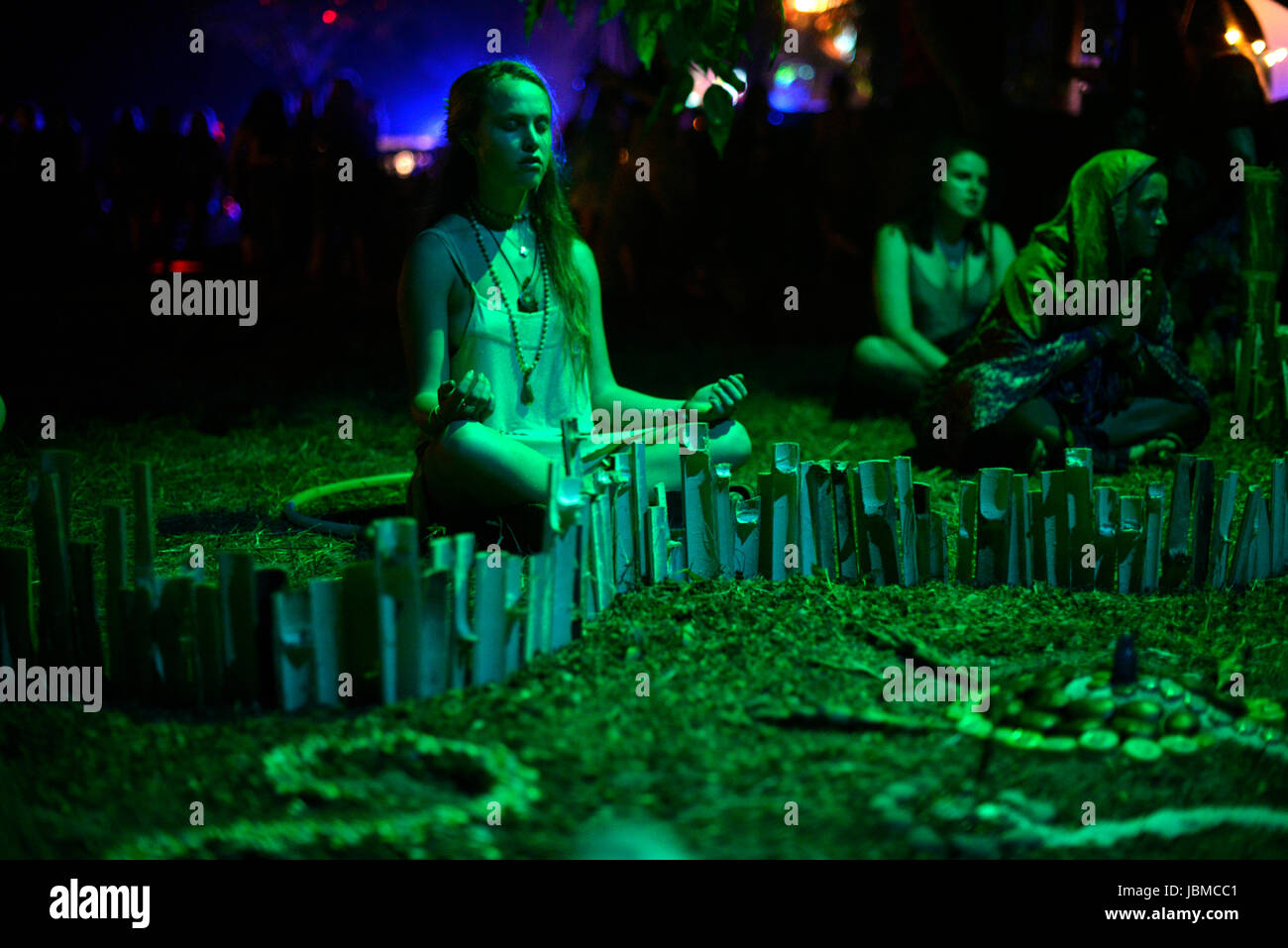 A festival attendant meditates at a zen garden at the 2015 Envision