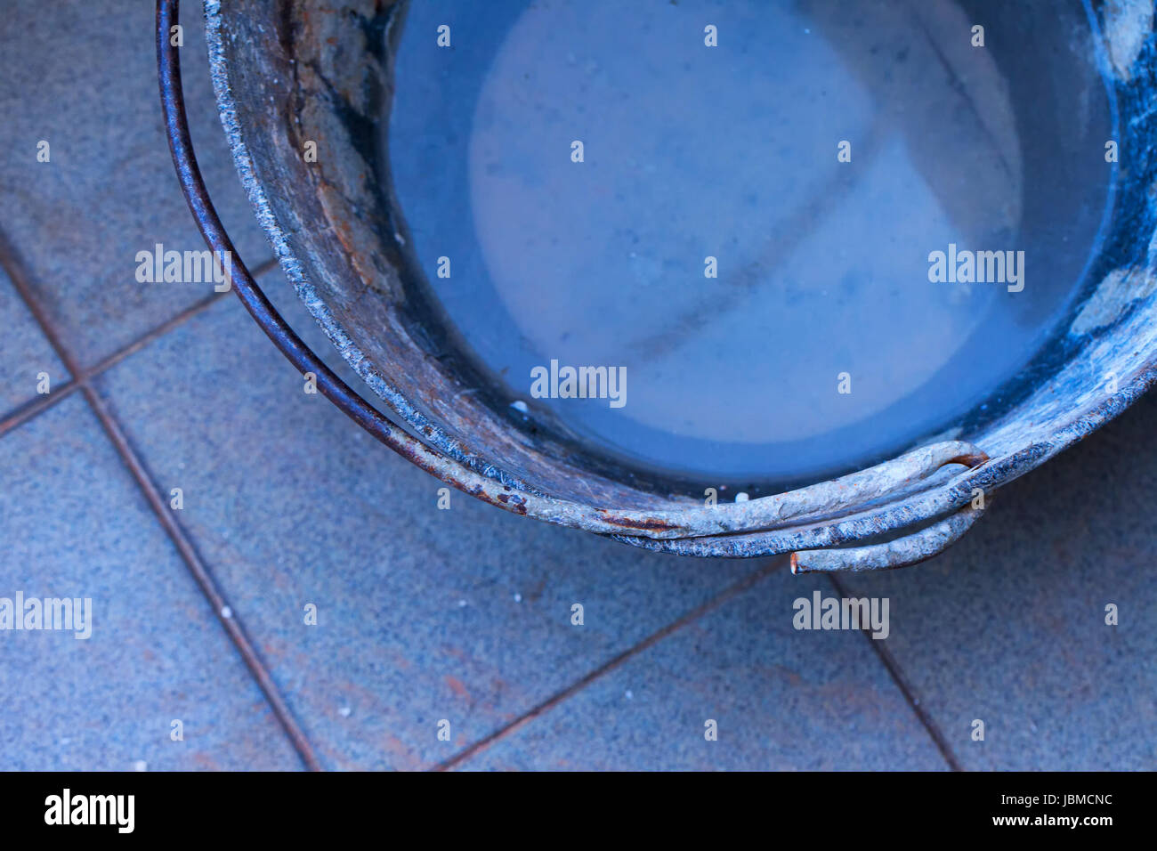Iron bucket with water for industrial work Stock Photo Alamy
