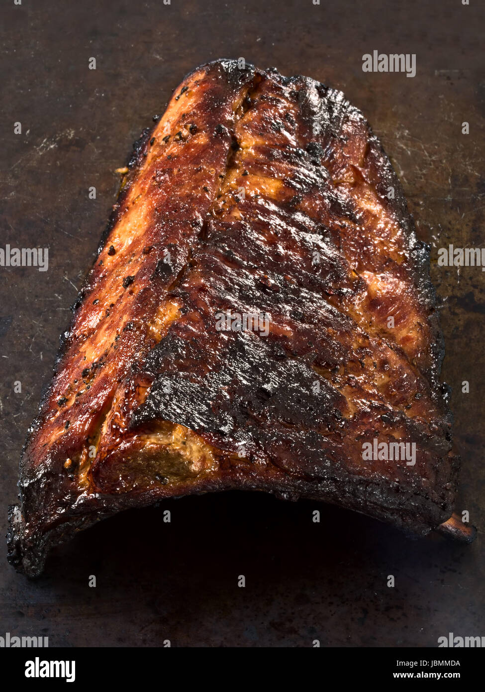 close up of a slab of rustic barbecued pork ribs Stock Photo - Alamy