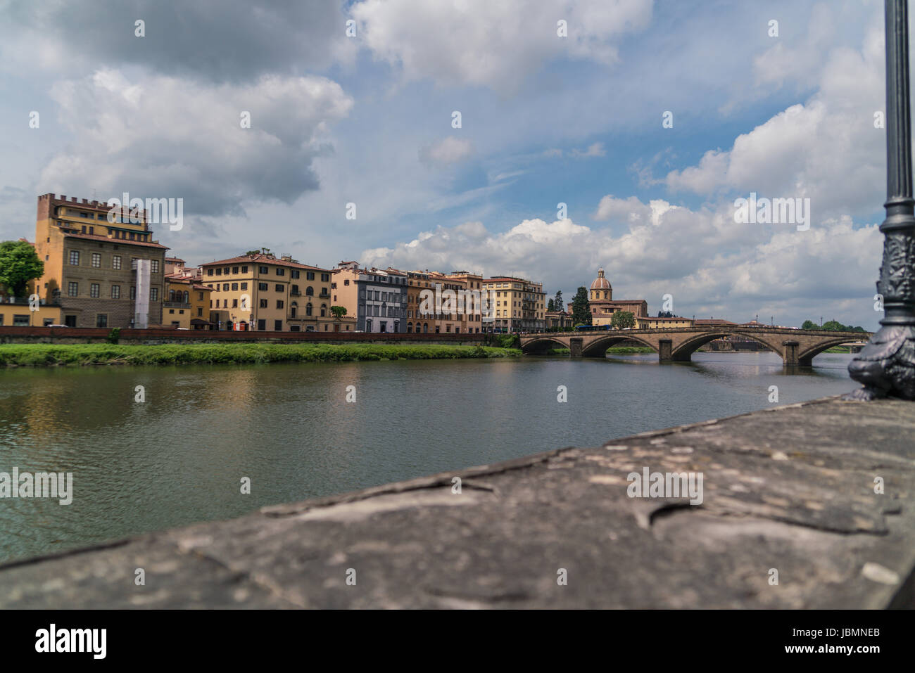 Horizontal composition of the River Arno in Florence  with dramatic clouds. Stock Photo