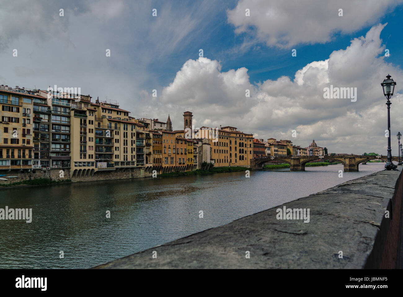 Horizontal composition of the River Arno in Florence  with dramatic clouds. Stock Photo