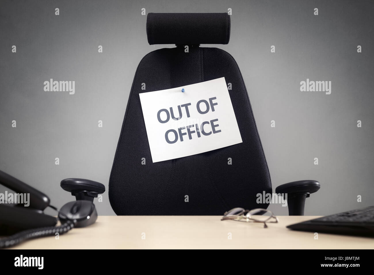 Business chair with out of office sign concept for vacation, holiday, lunch break or work life balance Stock Photo