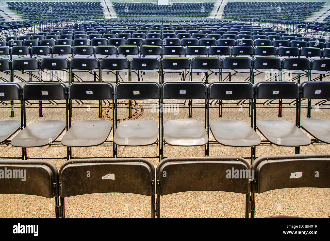 empty seats in many rows in a concert arena Stock Photo