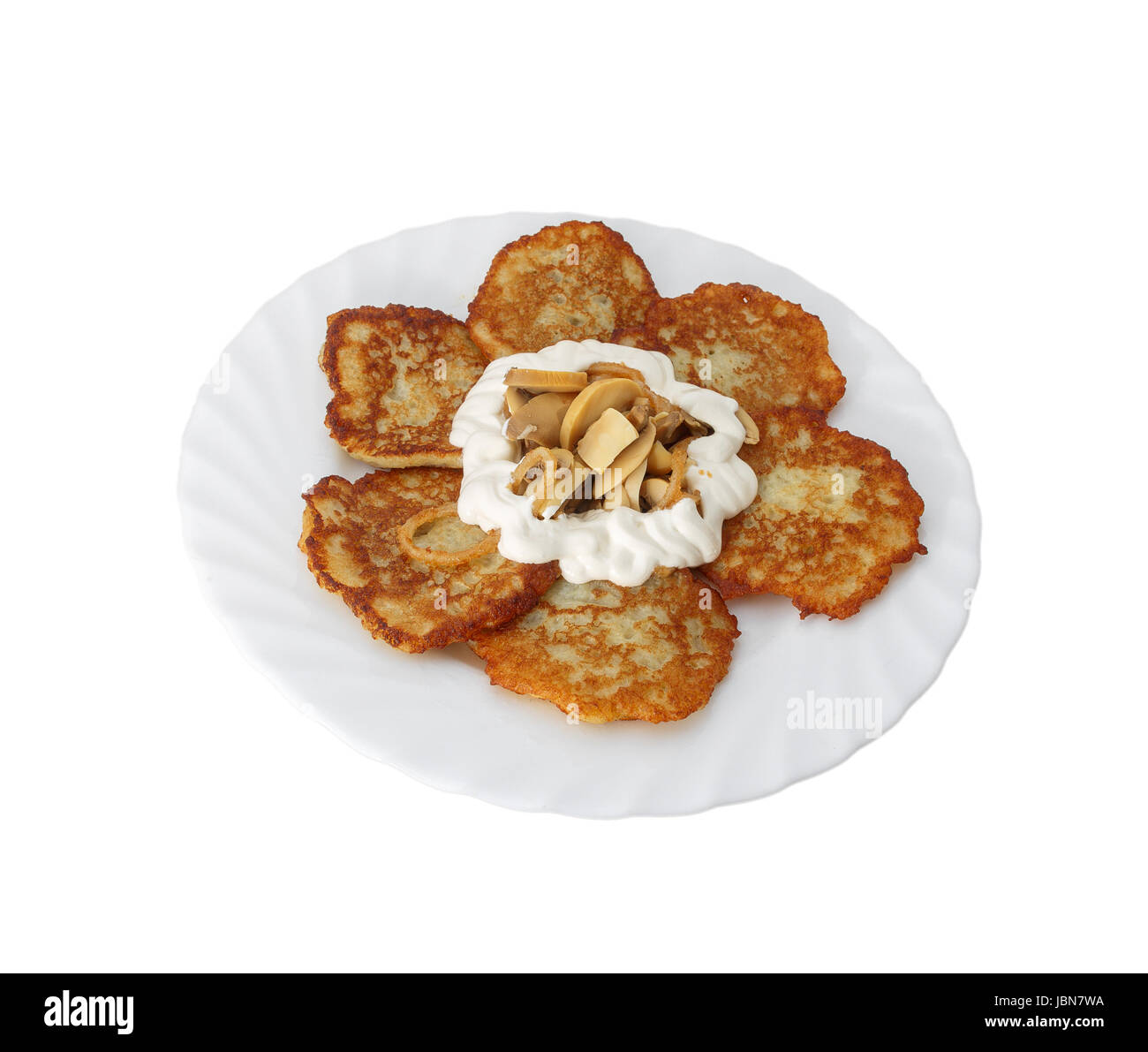 Pancake from potato. With sour cream and mushrooms. Stock Photo