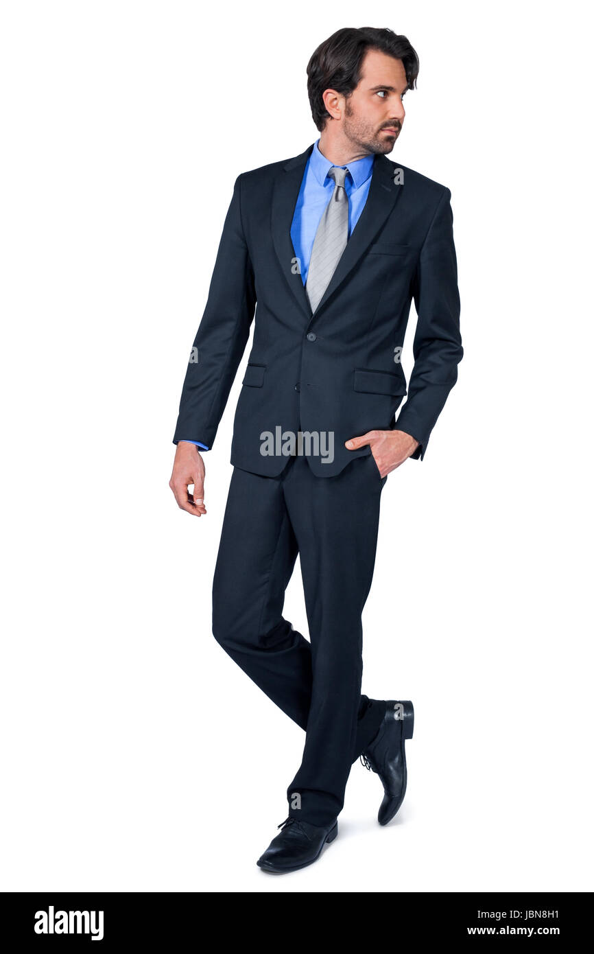 selbstbewuster junger Geschäftsmann mit Anzug dunklen Haaren und Bart isoliert vor weißem Hintergrund Stock Photo