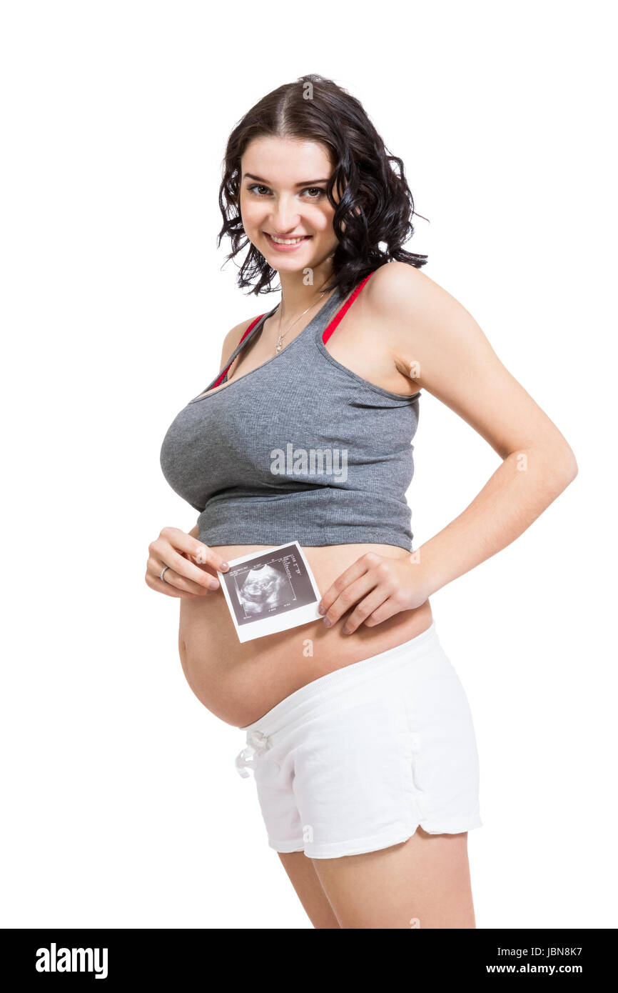 Junge attraktive Frau mit Ultraschall Bild in der Hand schwanger isoliert vor weißem Hintergrund Stock Photo