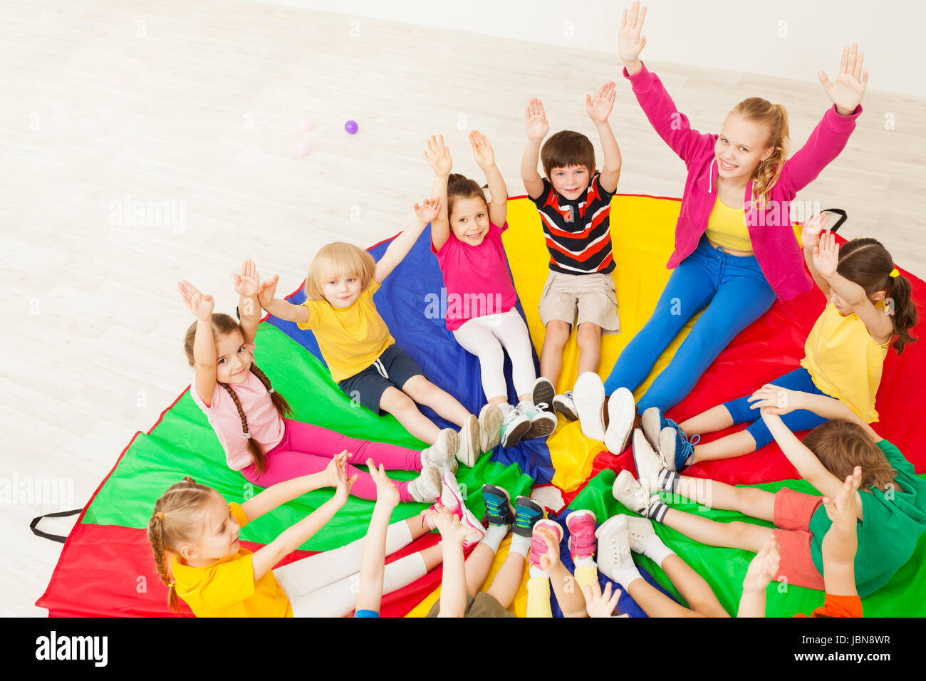 Group of children playing circle games hires stock photography and