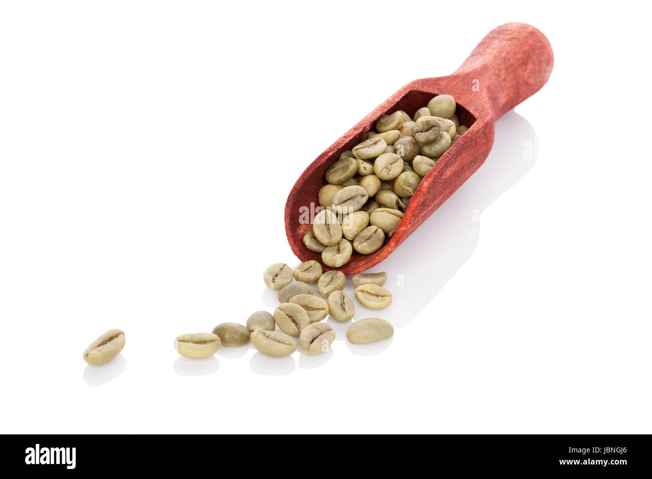 Green coffee beans on wooden scoop isolated on white background
