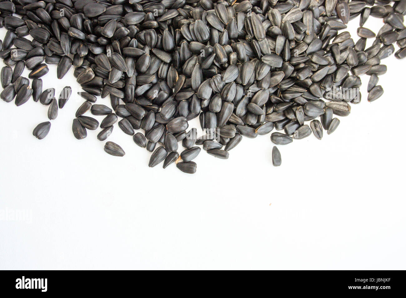 Sunflower seeds are black. Fried and salted. on a white background ...