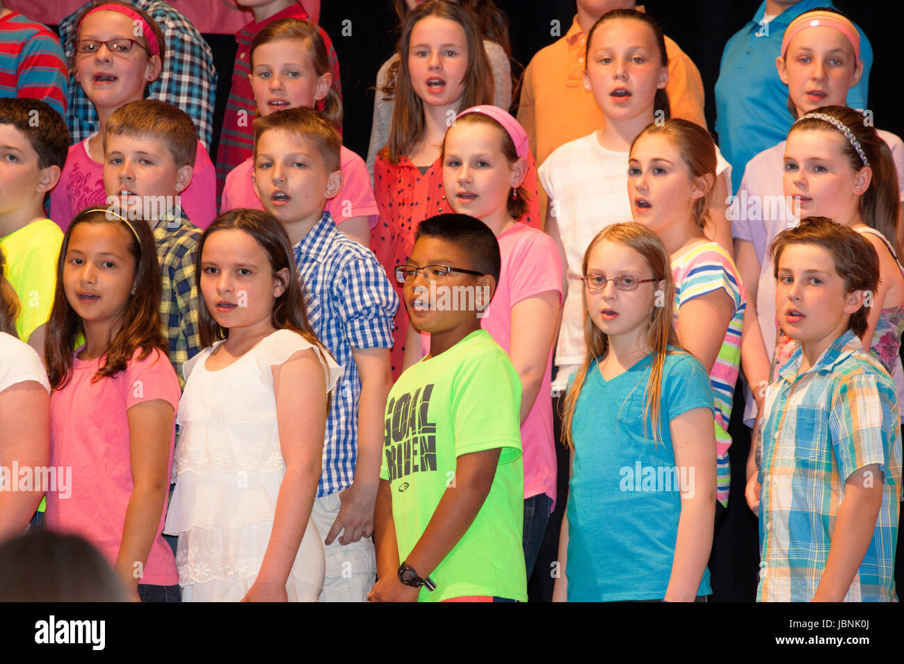 School concert of 5th graders singing in a choir. St Paul Minnesota MN USA Stock Photo