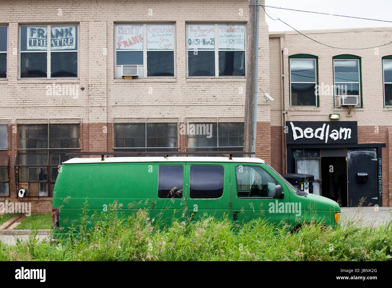 Buildings housing both the radical Bedlam and authentic Frank Theatres with green van parked outside. Minneapolis Minnesota MN USA Stock Photo
