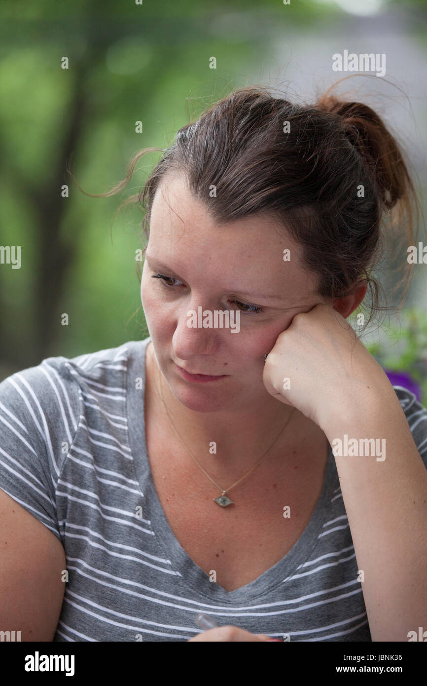 Woman age 35 feeling sad. St Paul Minnesota MN USA Stock Photo