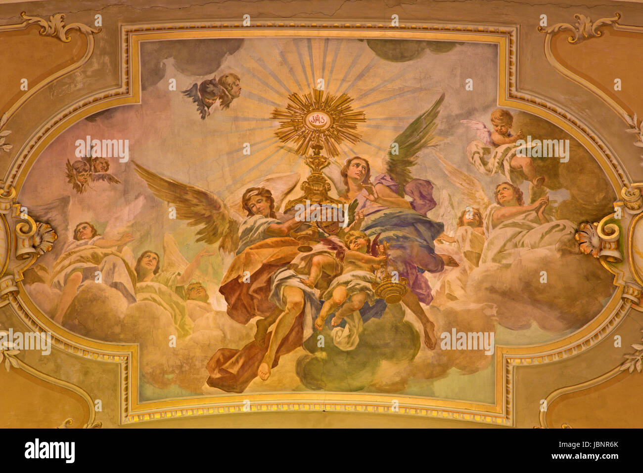 TURIN, ITALY - MARCH 13, 2017: The fresco of Eucharistic adoration of angels in ceiling of church Chiesa di Santo Tomaso by N. Arduino (1938). Stock Photo