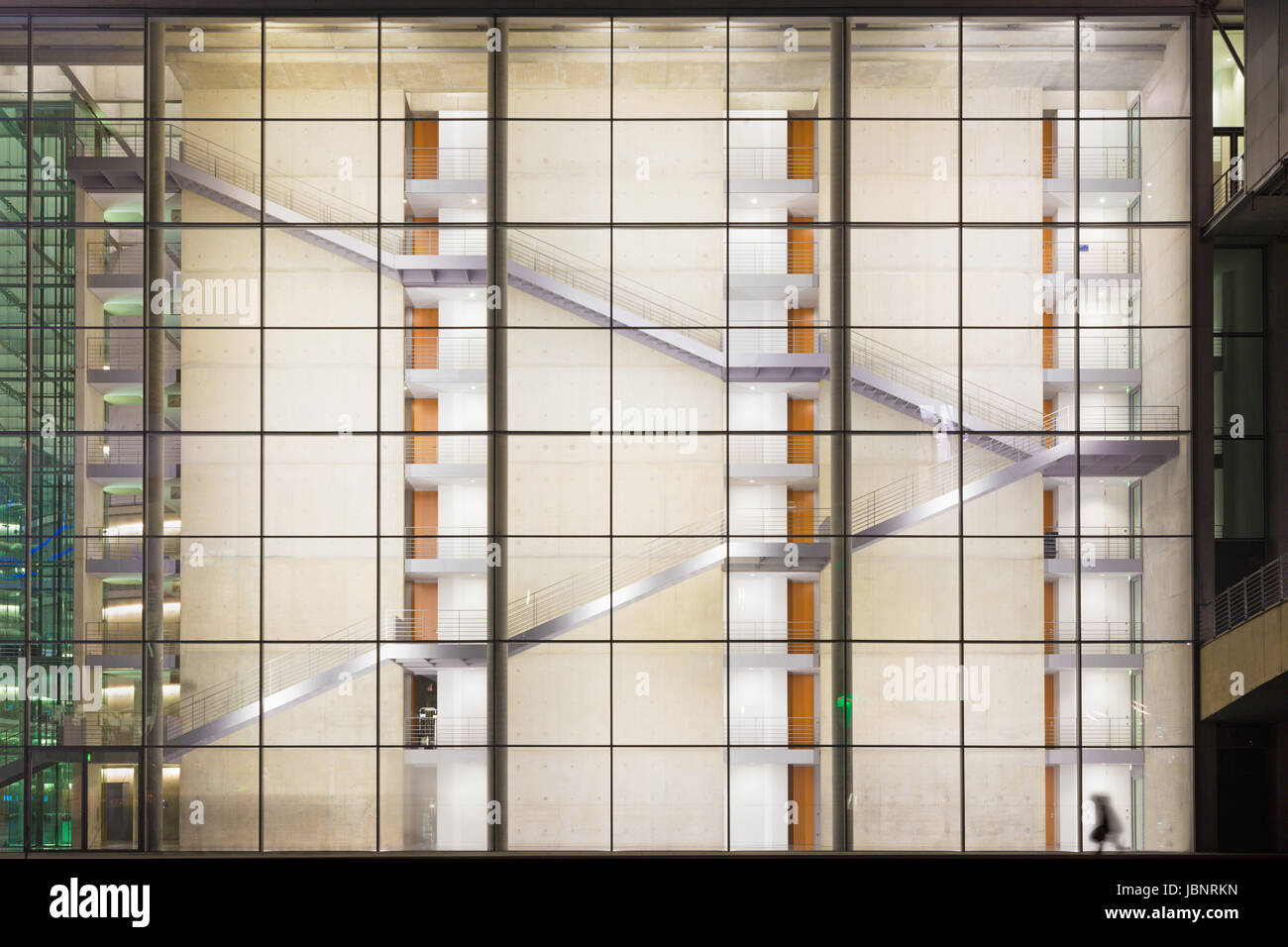 Berlin - The glass facade of modern Government building at night. Stock Photo