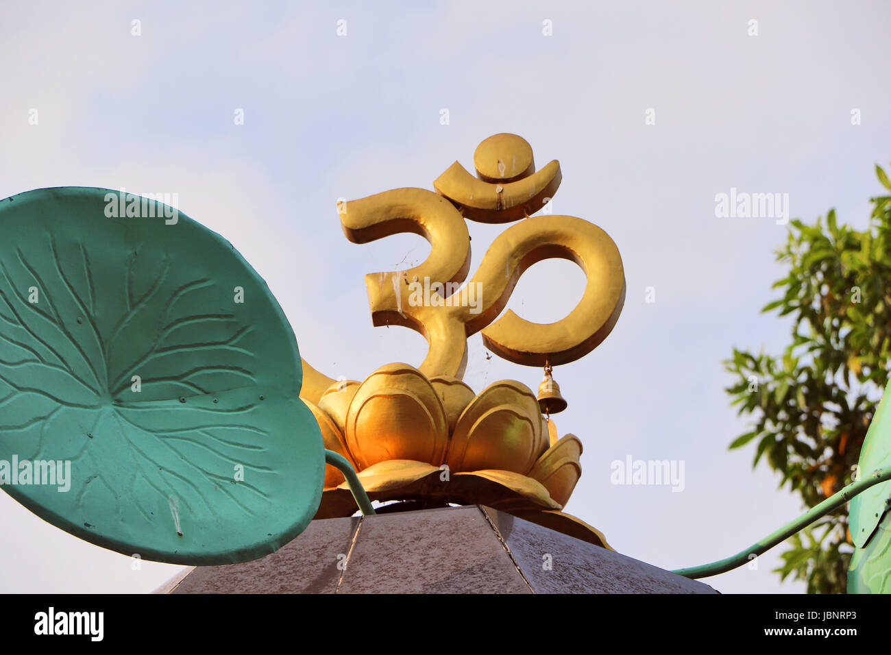 Devine ohm symbol in the open sky; according to Hindu myths, symbol represents the universal supreme powers. Stock Photo