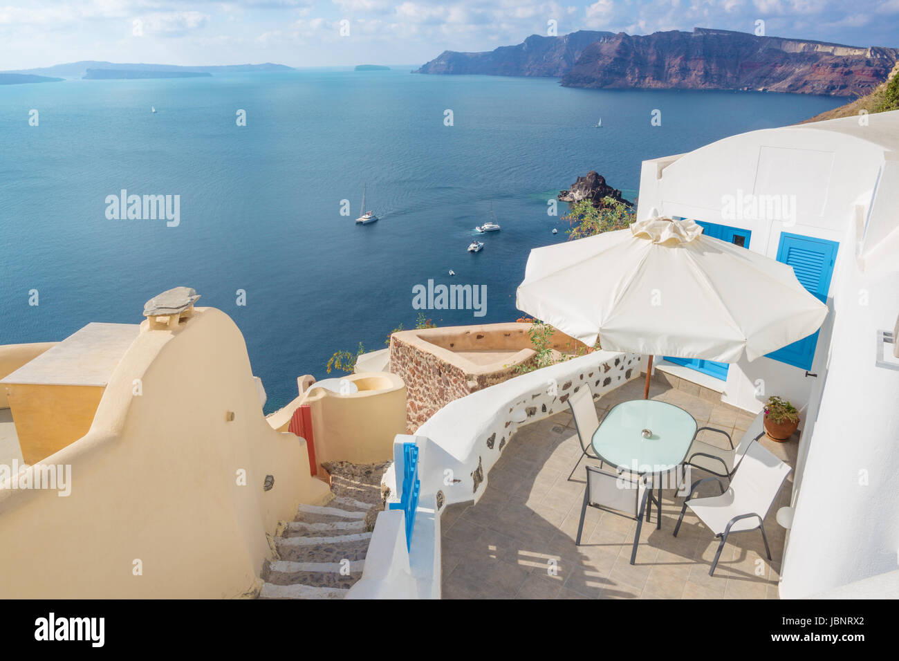 Santorini - The Oia and Therasia island in the background. Stock Photo