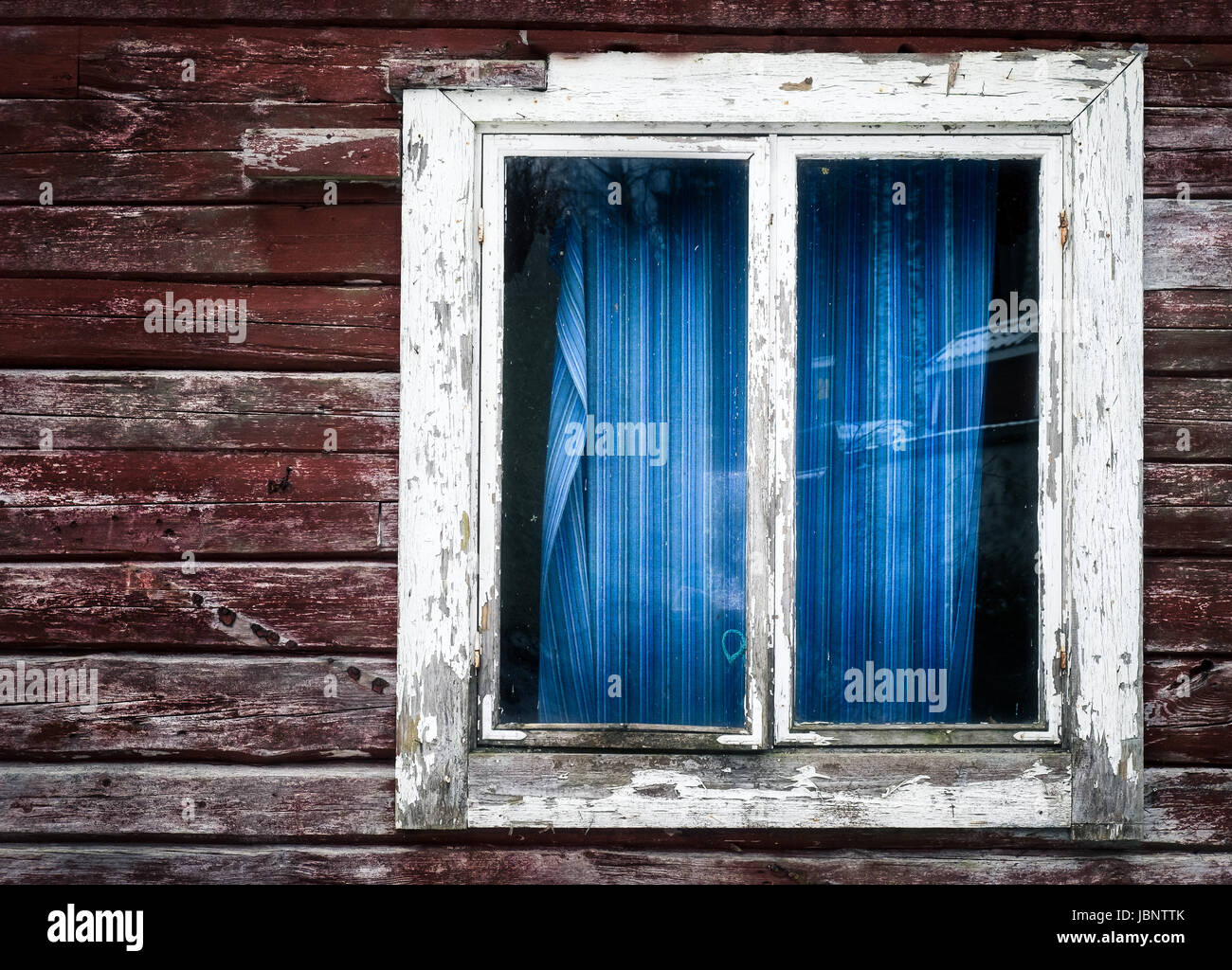 Old and abandoned house with wooden wall and window Stock Photo