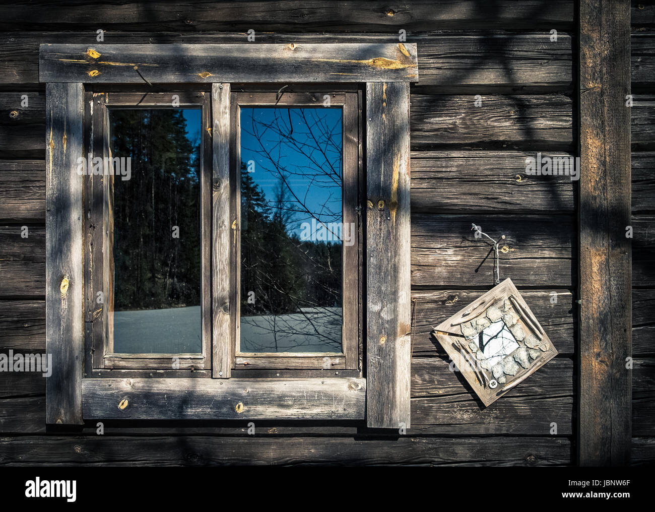 Abandoned house wooden wall with window reflection Stock Photo