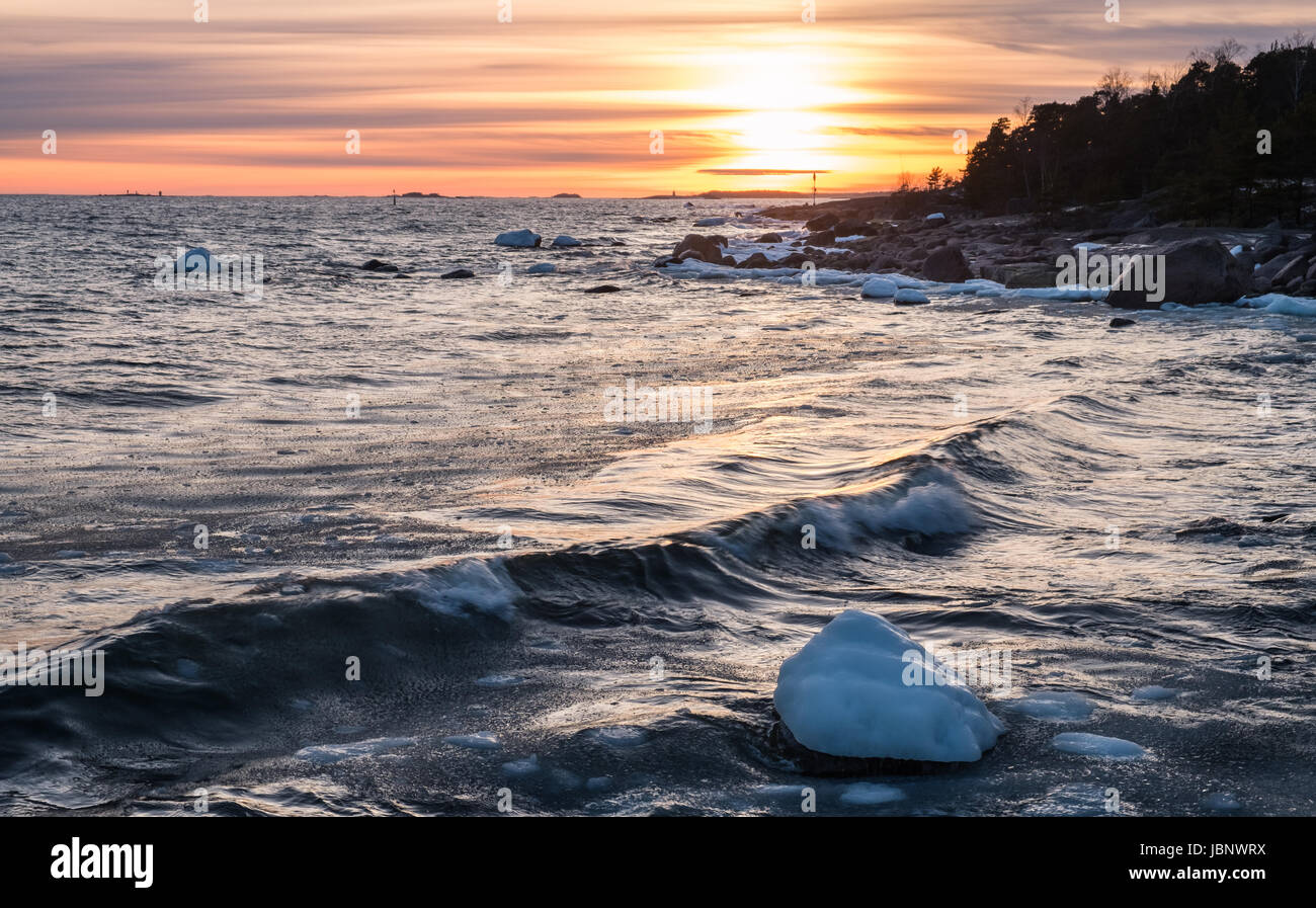 Scenic seascape with sunset at winter evening Stock Photo