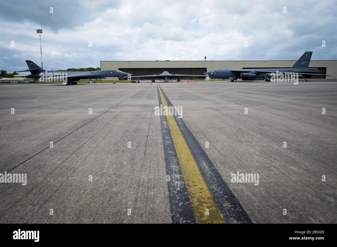 A USAF B-2 Spirit bomber, centre, B-1B Lancer, left and a B-52 Stratofortress, right, on the pan at RAF Fairford. Stock Photo