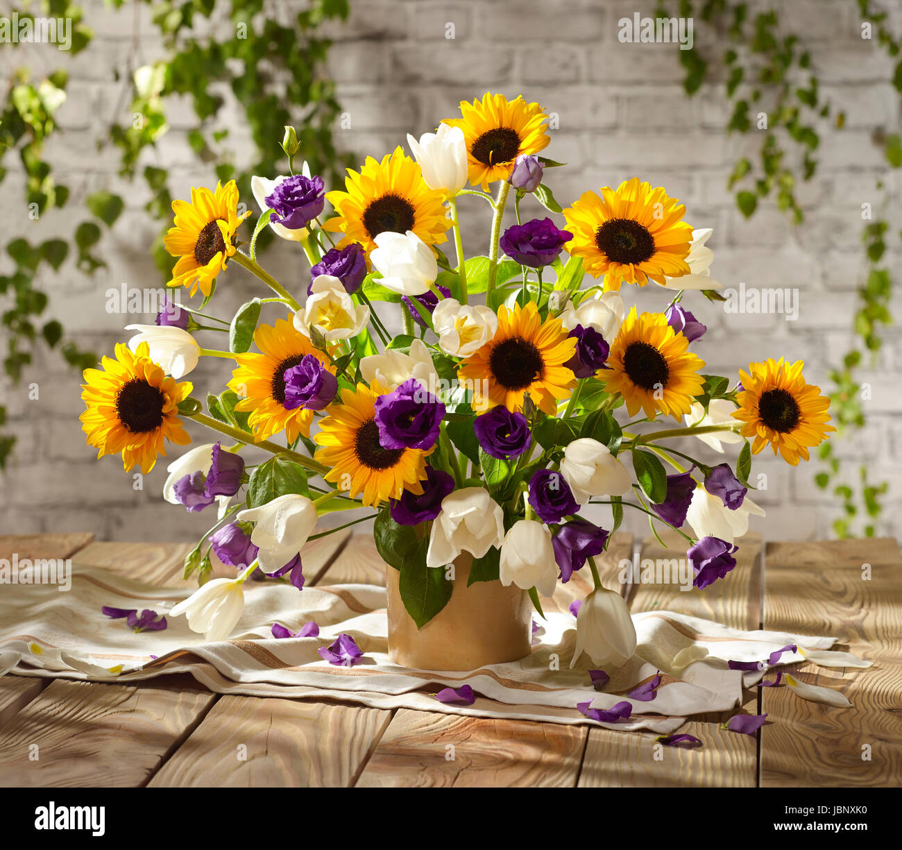 Bouquet of flowers with sunflowers, tulips and hibiscus Stock Photo Alamy