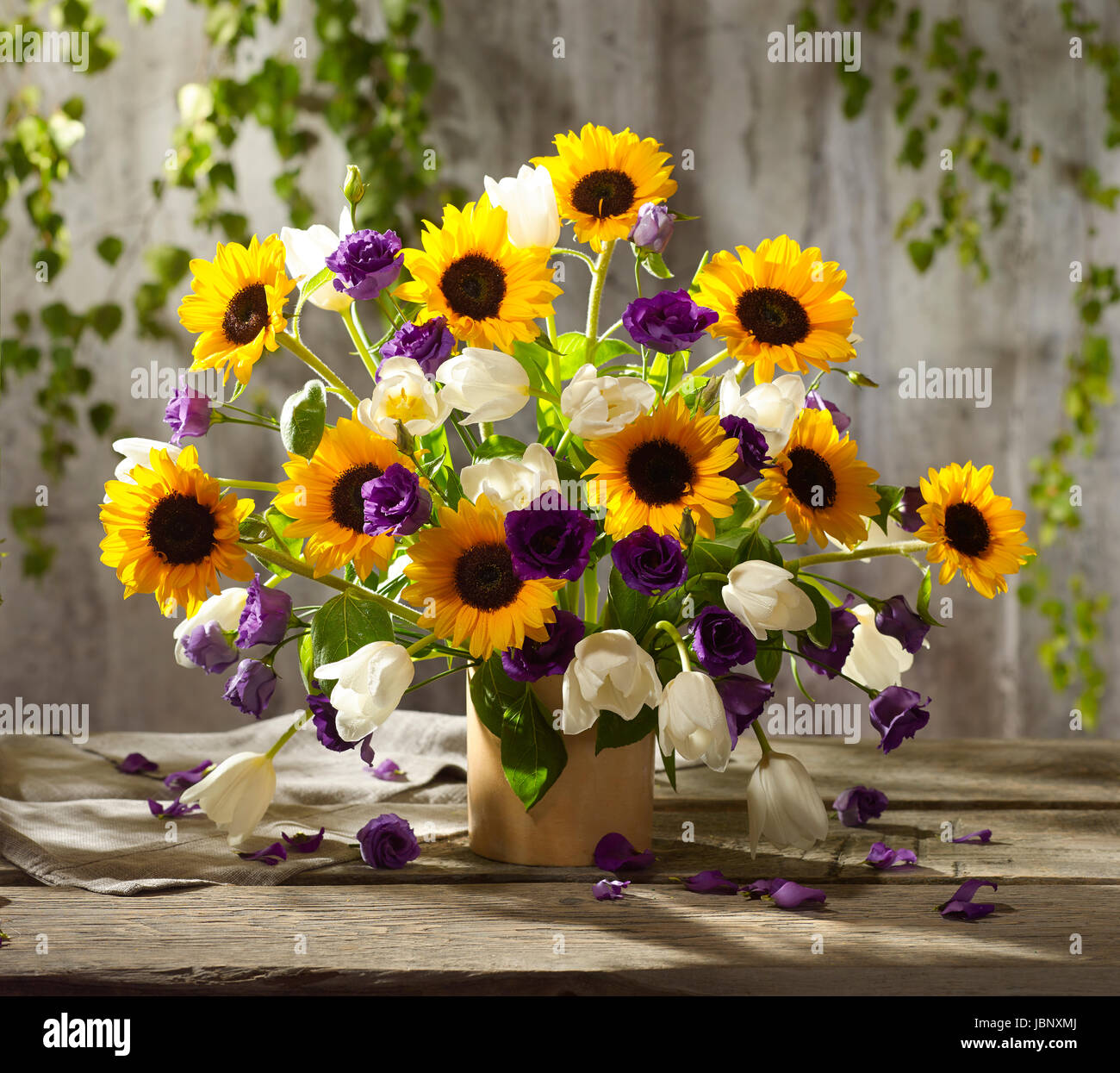 Bouquet of flowers with sunflowers, tulips and hibiscus Stock Photo Alamy
