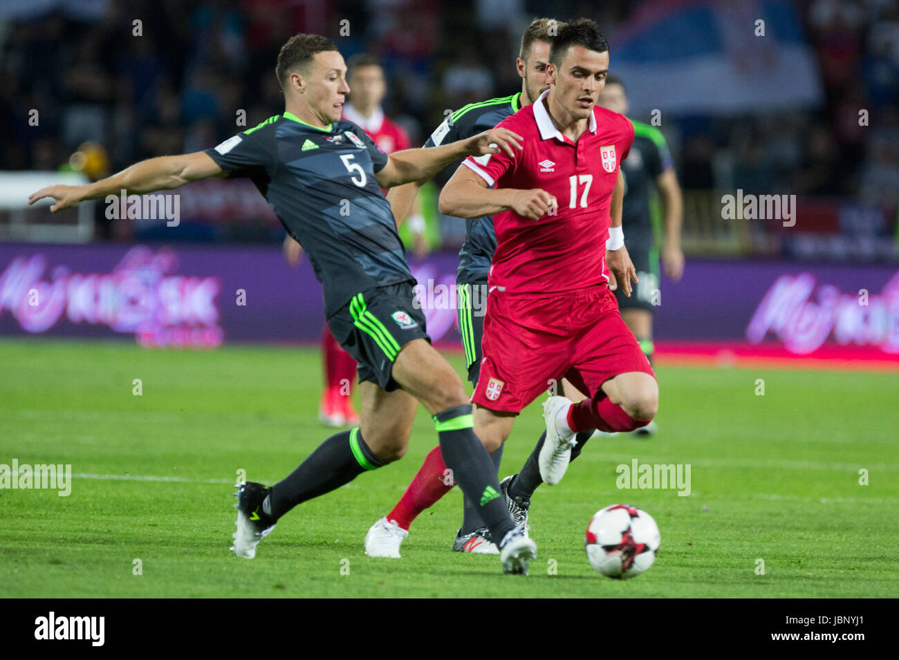 BELGRADE, SERBIA - JUNE 11, 2017: James Chester (L) of Wales in action against Filip Kostic (R) of Serbia during the 2018 FIFA World Cup Qualifier mat Stock Photo