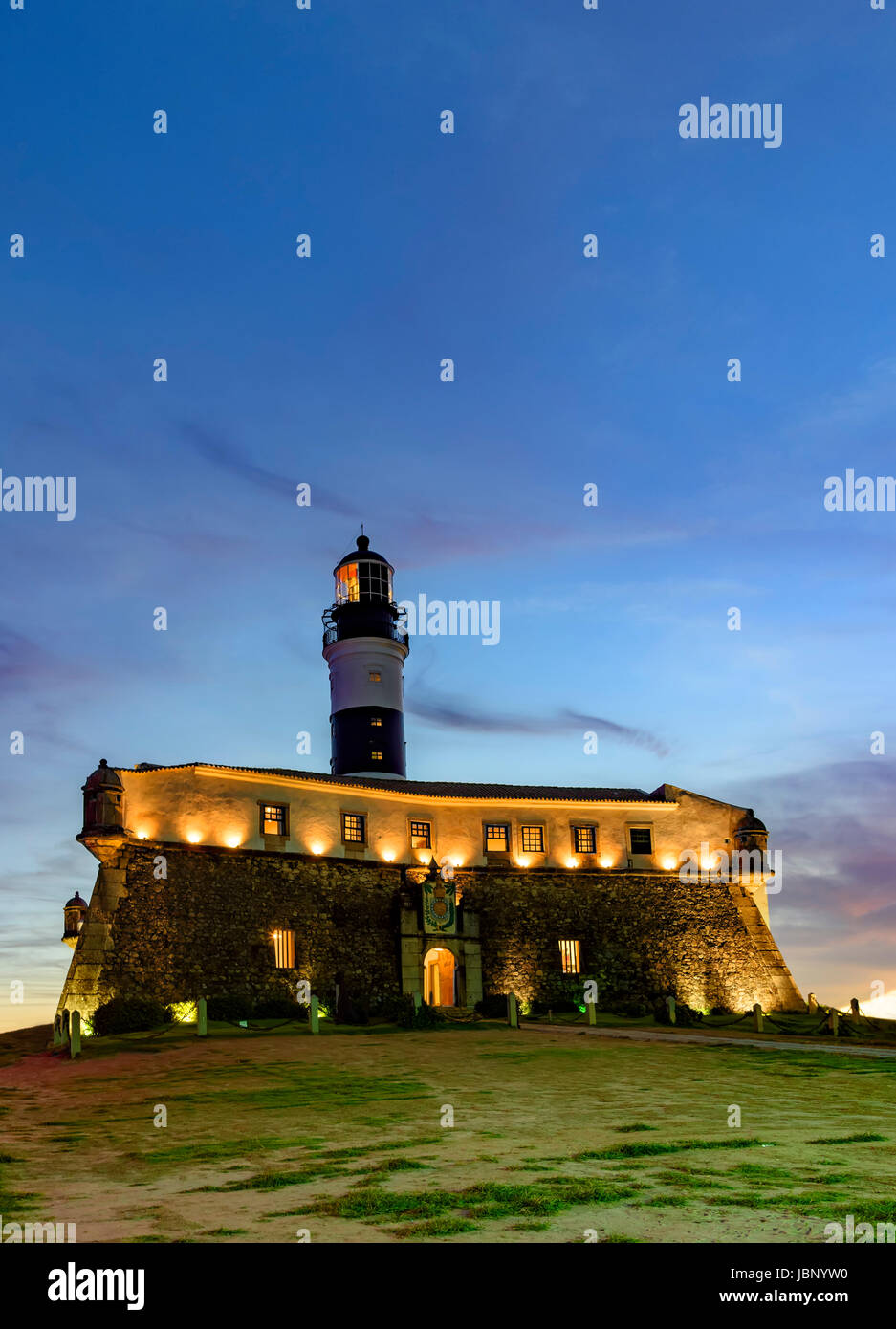 Night view of the famous and historic Barra Lighthouse on the banks of Todos os Santos bay in the city of Salvador, Bahia Stock Photo