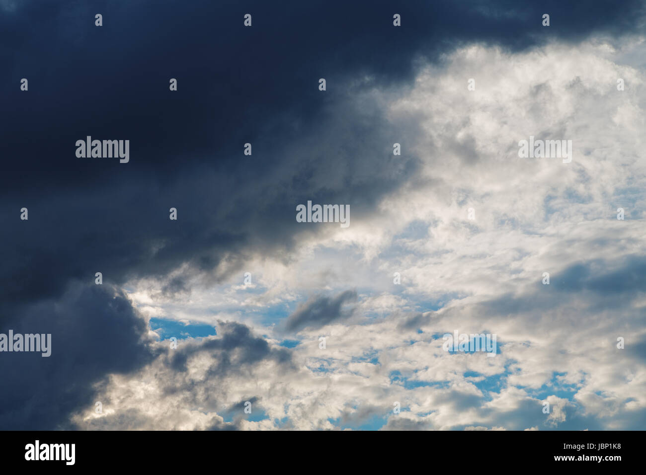 Cumulus clouds and the dark blue sky Stock Photo