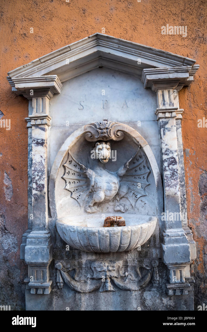 Drinking Fountain with a dragon on it. All Fountains in Rome run with pure water from the Hills