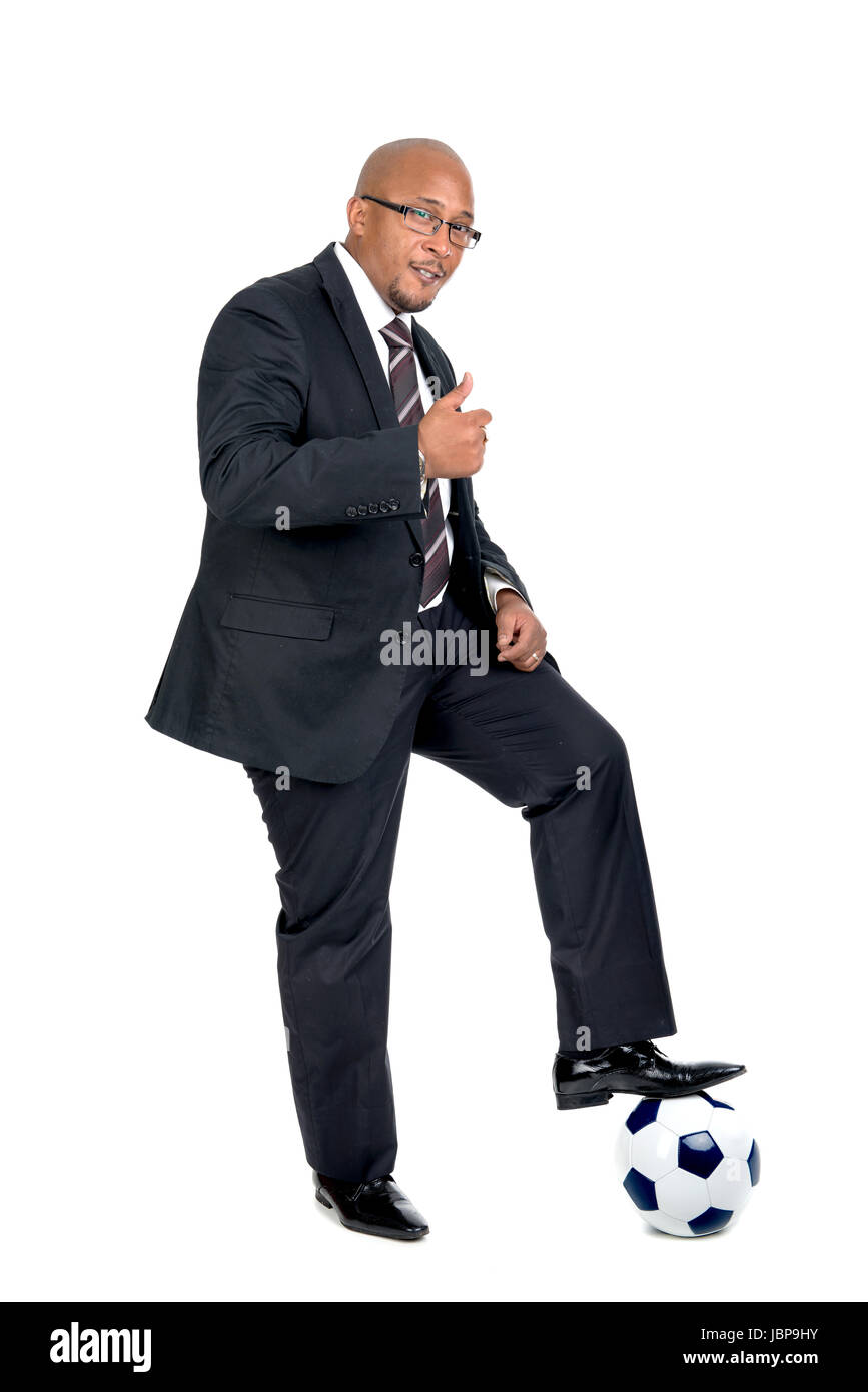 Businessman with soccer ball isolated in white Stock Photo - Alamy