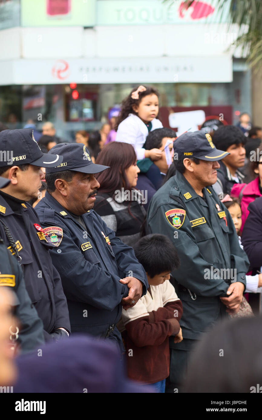 LIMA, PERU - JULY 21, 2013: Unidentified policemen on the Wong Parade in Miraflores on July 21, 2013 in Lima, Peru. The Parade (Gran Corso de Wong) is a traditional parade to celebrate the Peruvian national holiday which is on July 28-29. Stock Photo