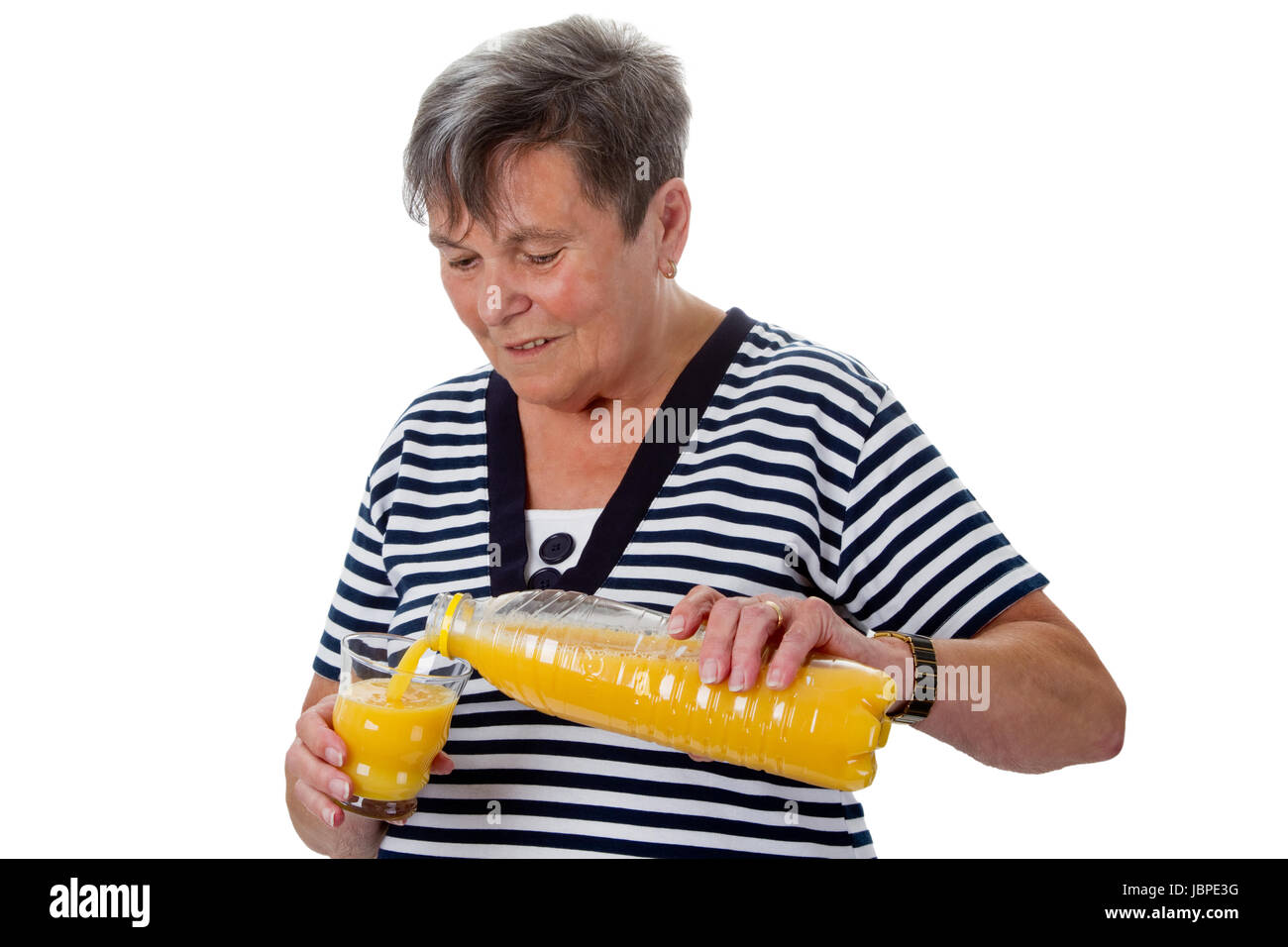 Seniorin trinkt Orangensaft - Freisteller Stock Photo
