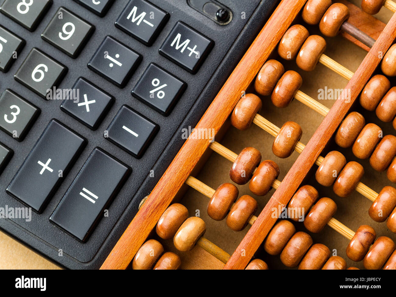 Ancient abacus and modern calculator Stock Photo - Alamy