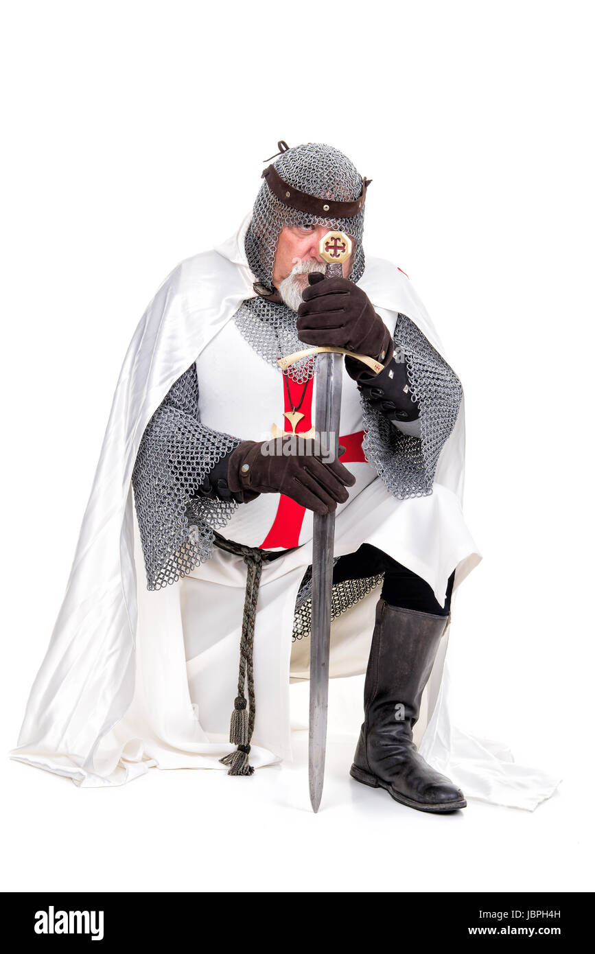 Knight Templar praying isolated in white Stock Photo