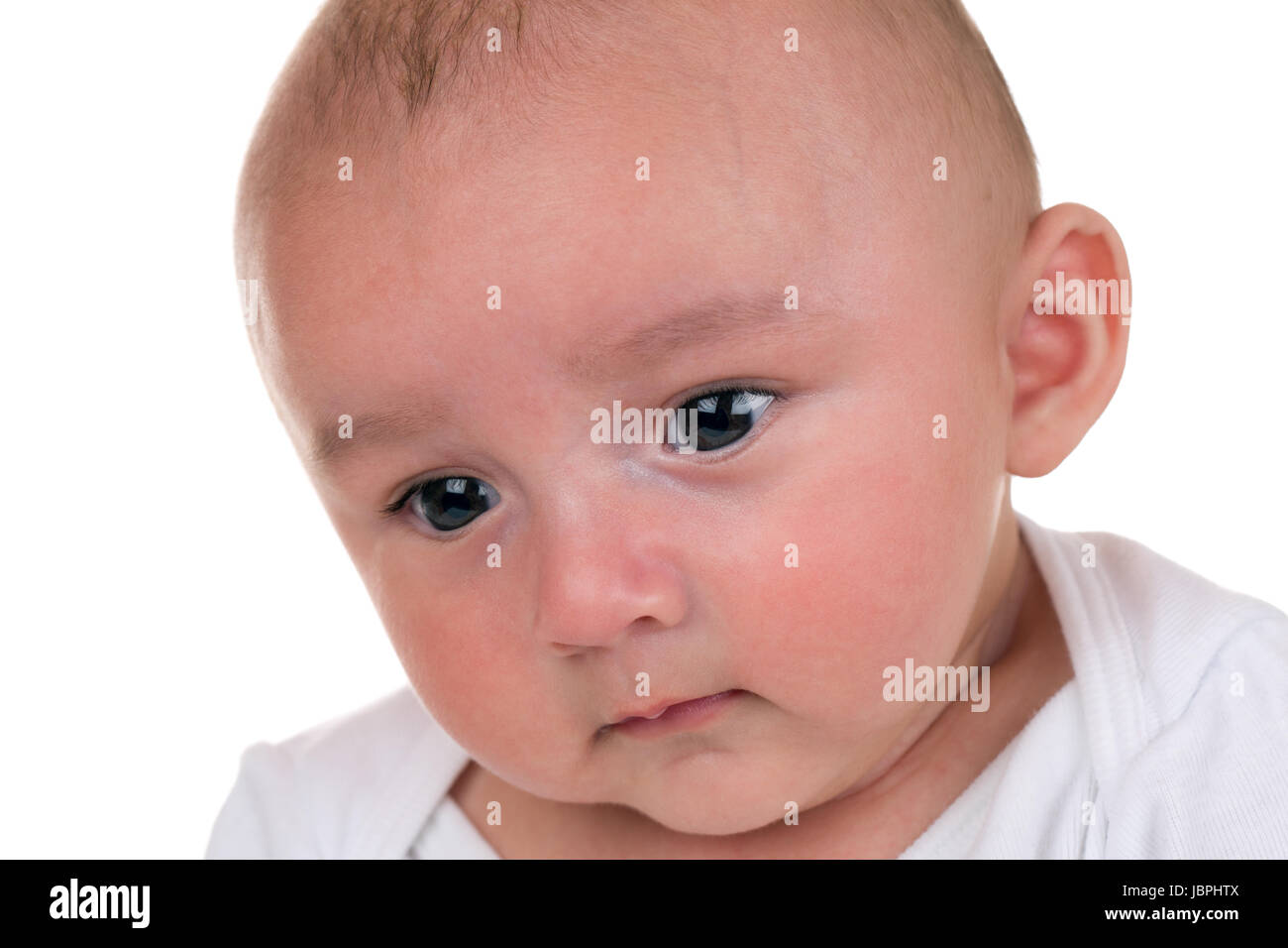 Baby ist traurig, isoliert vor einem weissen Hintergrund Stock Photo
