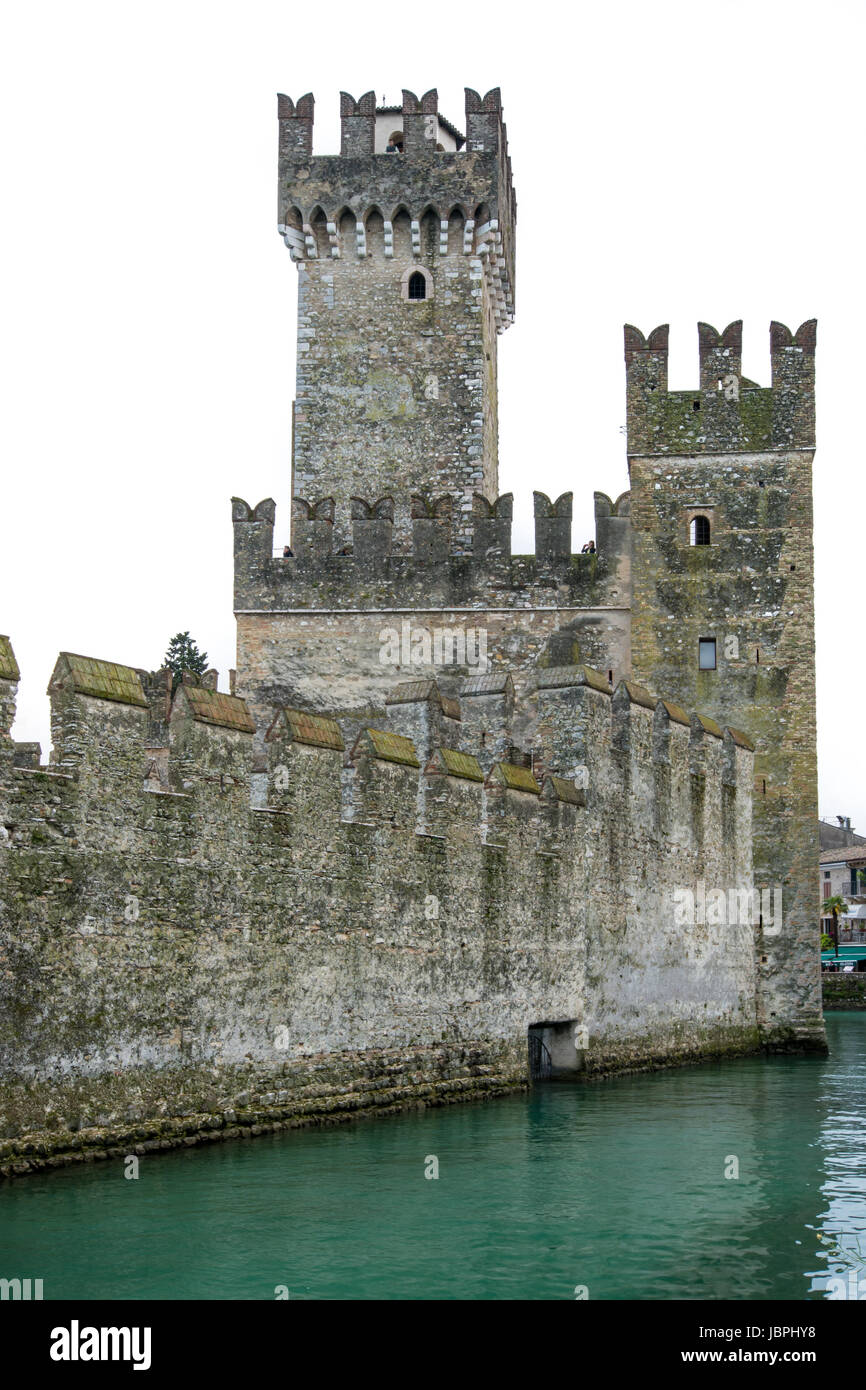 SIRMIONE, ITALY - APRIL 23: The Scaliger Caslte in Sirmione, Italy on April 23, 2014. The famous castle was built in the 13th century. Foto taken from Piazza Castello. Stock Photo