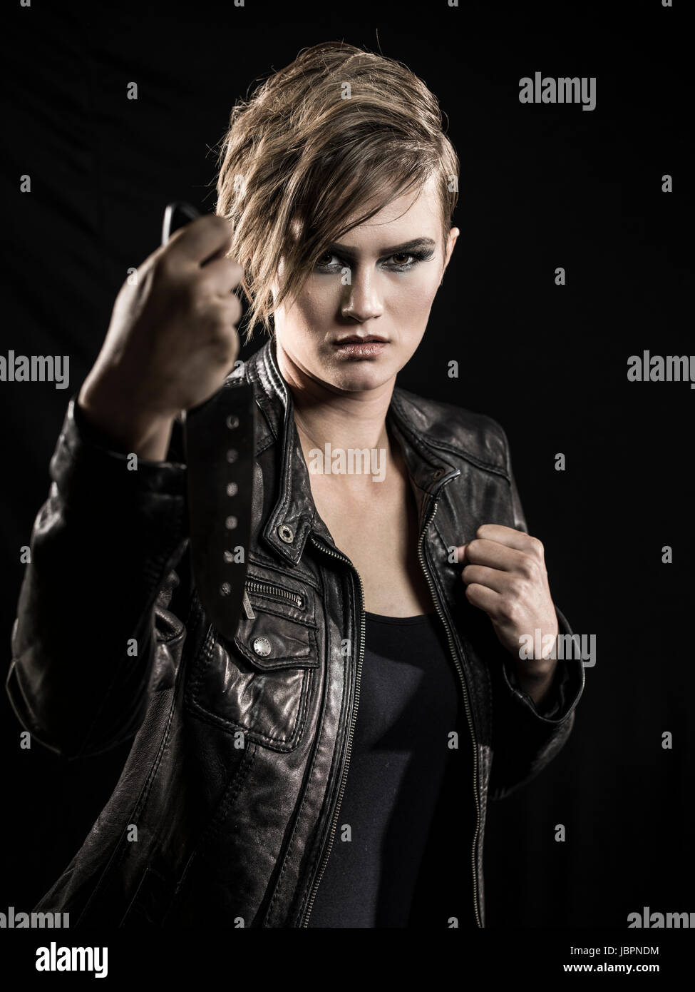 Young woman using knife as a weapon Stock Photo Alamy