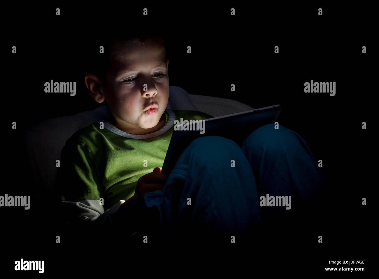 Cute little boy with a tablet pc Stock Photo - Alamy
