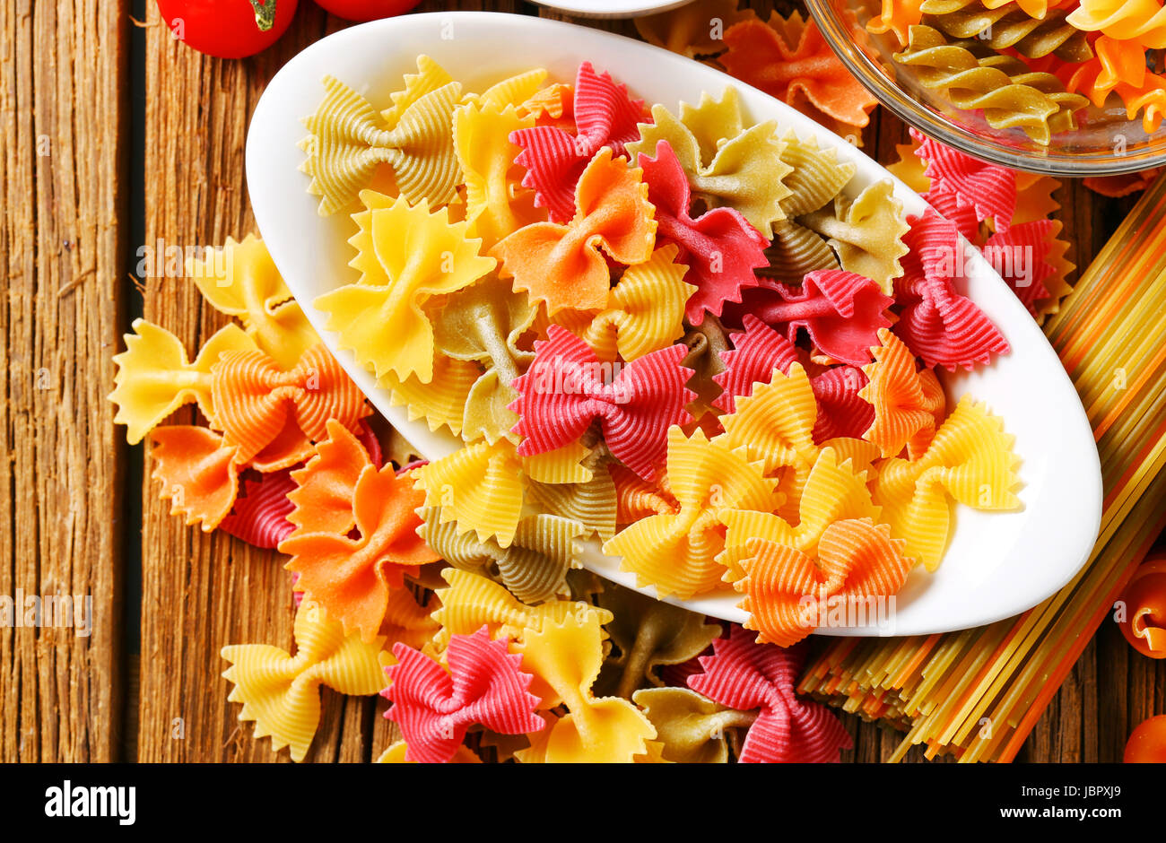 Flavored and colored bow tie pasta Stock Photo Alamy