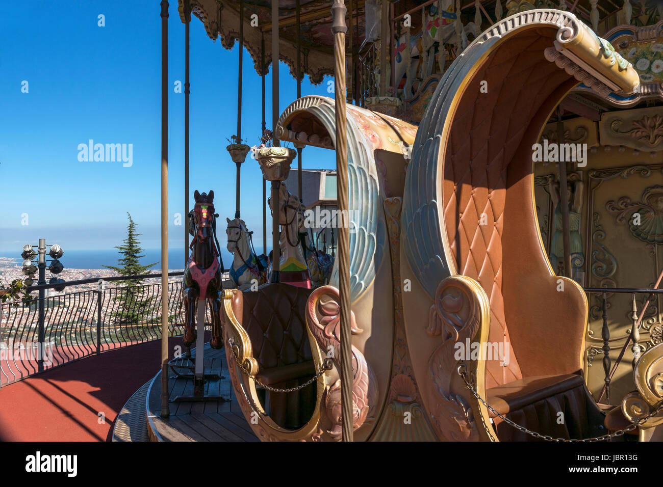Ride on a century old carousel at Tibidabo Amusement Park provides breathtaking panoramic views of Barcelona Stock Photo